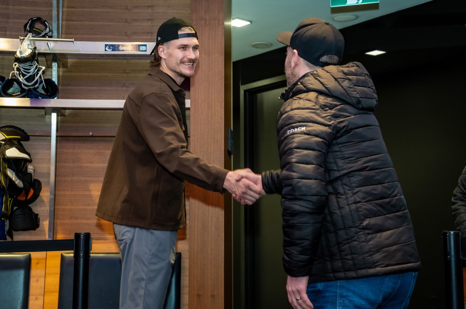 Canucks forward Curtis Douglas shaking hands with the author in the Canucks dressing room